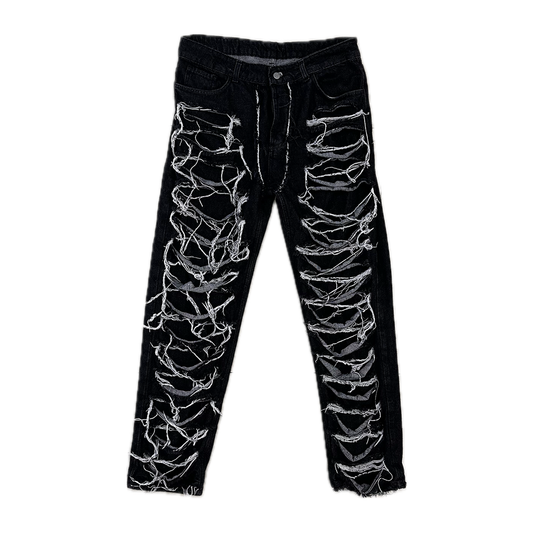 Trousers with tears